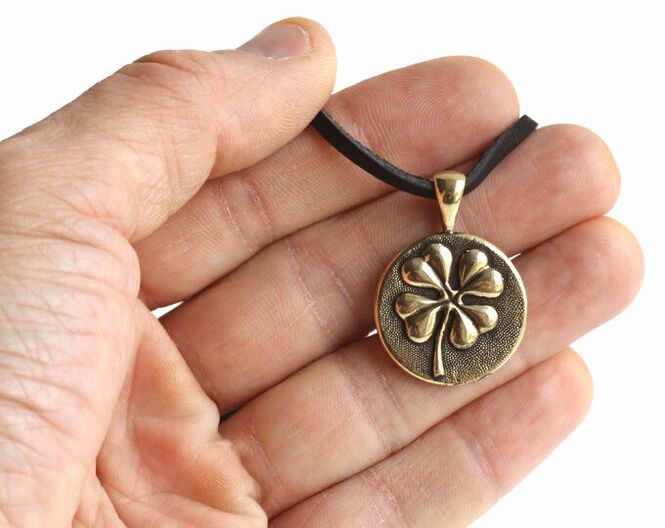 Four-leaf clover amulet brings luck and love
